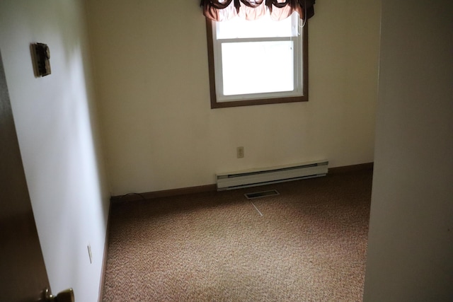 113 Pleasant St, Greenville, ME 04441 - spare room with baseboard heating and carpet