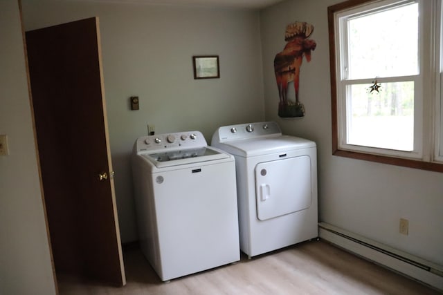 113 Pleasant St, Greenville, ME 04441 - laundry room with a baseboard heating unit, washer and dryer, healthy amount of natural light, and light wood-style floors