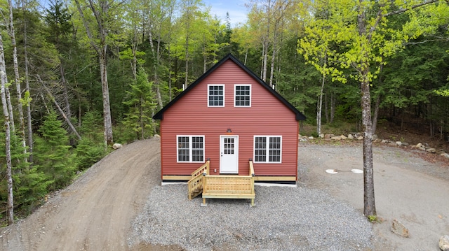 23 Bray Cir, Passadumkeag, ME 04475 - view of front of property featuring a wooded view and driveway