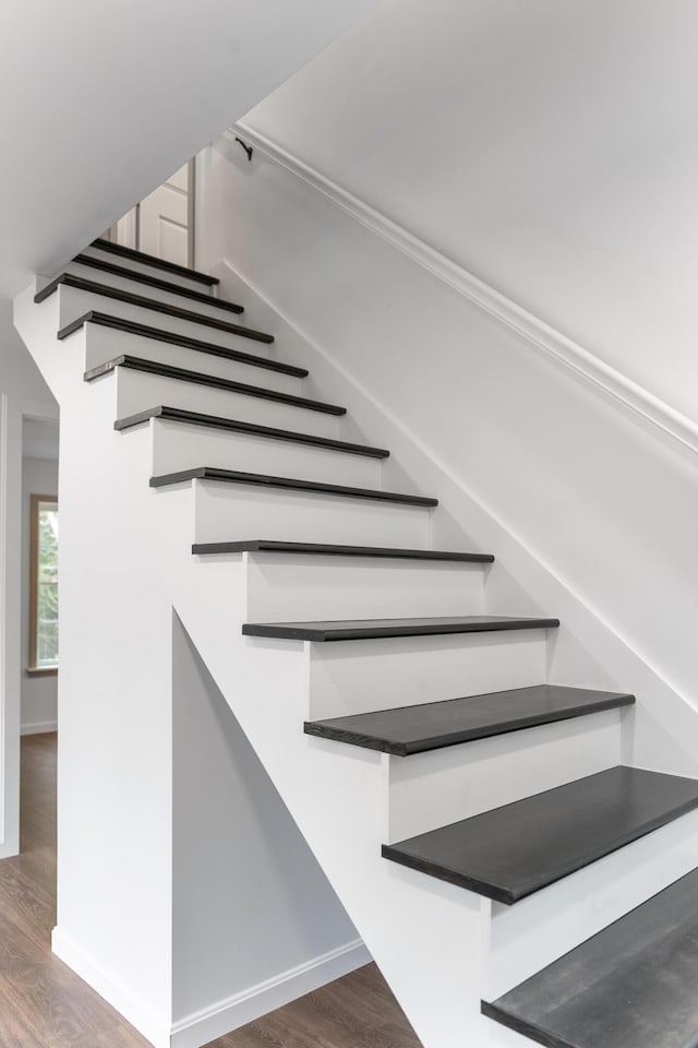 23 Bray Cir, Passadumkeag, ME 04475 - stairs featuring wood finished floors and baseboards