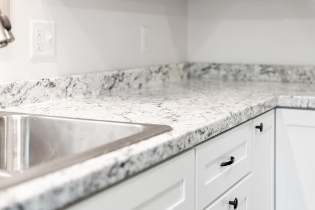 23 Bray Cir, Passadumkeag, ME 04475 - kitchen view of white cabinetry and a sink