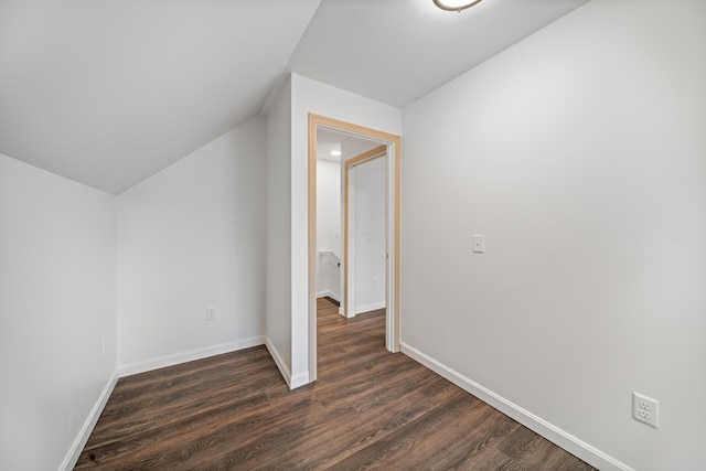 23 Bray Cir, Passadumkeag, ME 04475 - additional living space featuring dark wood-style floors, vaulted ceiling, and baseboards
