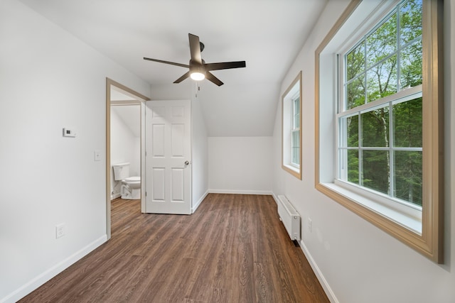 23 Bray Cir, Passadumkeag, ME 04475 - bonus room with dark wood finished floors, ceiling fan, baseboards, and vaulted ceiling