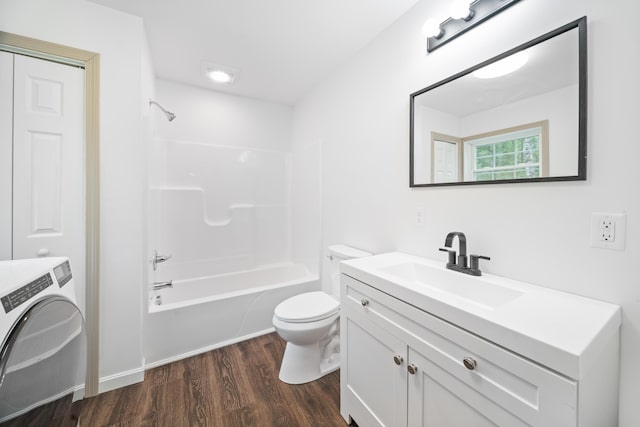 23 Bray Cir, Passadumkeag, ME 04475 - bathroom featuring vanity, washer / dryer, wood finished floors, and toilet