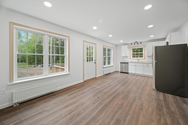 23 Bray Cir, Passadumkeag, ME 04475 - kitchen featuring radiator, appliances with stainless steel finishes, white cabinetry, dark wood finished floors, and recessed lighting
