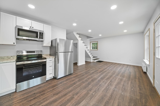 23 Bray Cir, Passadumkeag, ME 04475 - kitchen featuring stainless steel appliances, dark wood-style floors, recessed lighting, white cabinetry, and baseboards