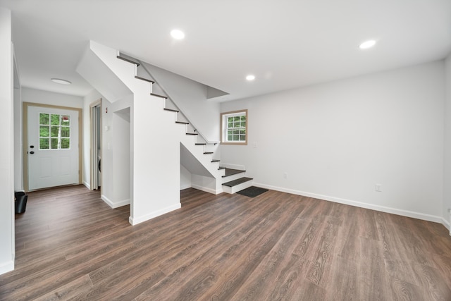 23 Bray Cir, Passadumkeag, ME 04475 - basement featuring stairway, dark wood-style flooring, healthy amount of natural light, baseboards, and recessed lighting
