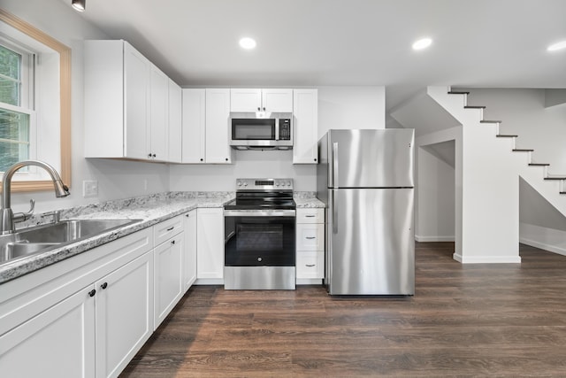 23 Bray Cir, Passadumkeag, ME 04475 - kitchen with appliances with stainless steel finishes, a sink, dark wood-style floors, recessed lighting, and white cabinetry
