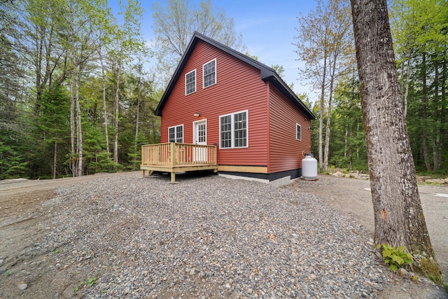 23 Bray Cir, Passadumkeag, ME 04475 - view of side of home with a wooden deck