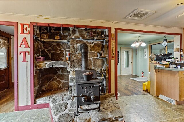 753 Ridge Rd, Windsor, ME 04363 - interior space with wood finished floors and a wood stove