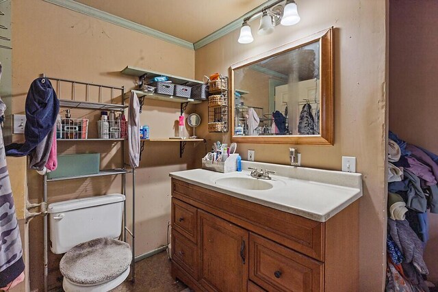 753 Ridge Rd, Windsor, ME 04363 - bathroom featuring ornamental molding, vanity, and toilet