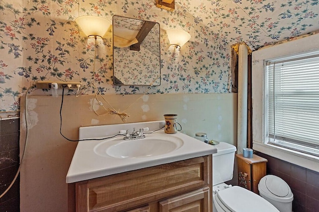 753 Ridge Rd, Windsor, ME 04363 - half bathroom featuring wallpapered walls, a wainscoted wall, toilet, and vanity