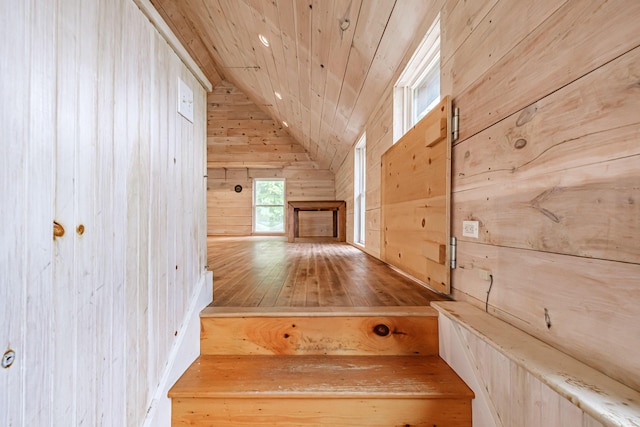 76 Old W Bethel Road, Albany Twp, ME 04217 - stairs featuring wooden walls, wood ceiling, lofted ceiling, and hardwood / wood-style floors