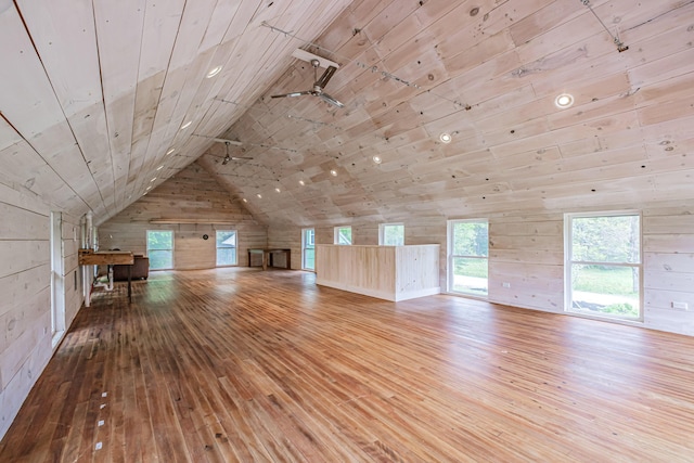 76 Old W Bethel Road, Albany Twp, ME 04217 - unfurnished living room featuring wooden walls, hardwood / wood-style floors, wood ceiling, lofted ceiling, and healthy amount of natural light
