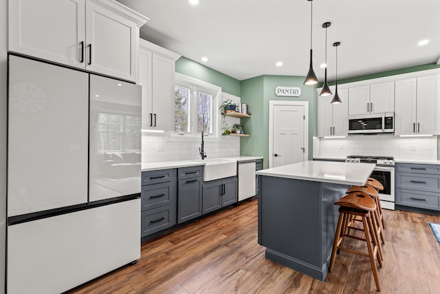 64 Autumn Rdg, Sabattus, ME 04280 - kitchen featuring stainless steel appliances, gray cabinetry, a sink, tasteful backsplash, and recessed lighting