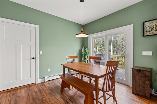 64 Autumn Rdg, Sabattus, ME 04280 - dining area featuring wood finished floors, a baseboard heating unit, and baseboards