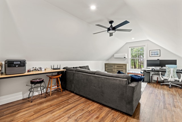 64 Autumn Rdg, Sabattus, ME 04280 - living room with a wall unit AC, an office area, wood finished floors, ceiling fan, and vaulted ceiling