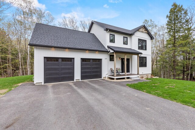 64 Autumn Rdg, Sabattus, ME 04280 - modern farmhouse with an attached garage, a shingled roof, driveway, and a front yard
