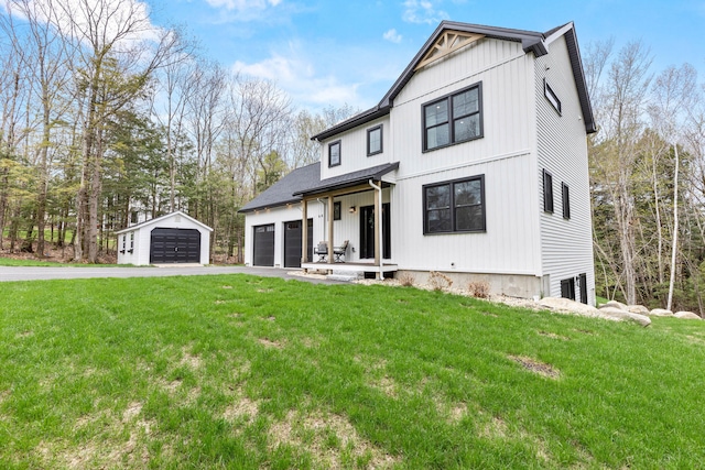 64 Autumn Rdg, Sabattus, ME 04280 - modern farmhouse style home with a front lawn, asphalt driveway, and an outdoor structure