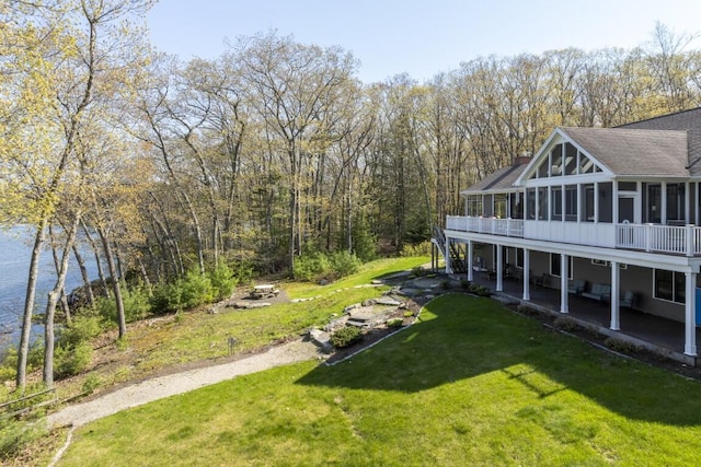 50 Higbee Ln, Boothbay, ME 04571 - view of grassy yard featuring a sunroom, a patio, and a water view