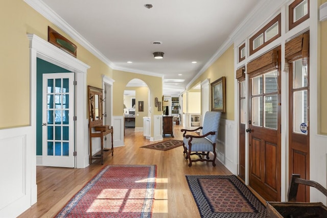 50 Higbee Ln, Boothbay, ME 04571 - foyer featuring wood finished floors, arched walkways, ornamental molding, wainscoting, and recessed lighting
