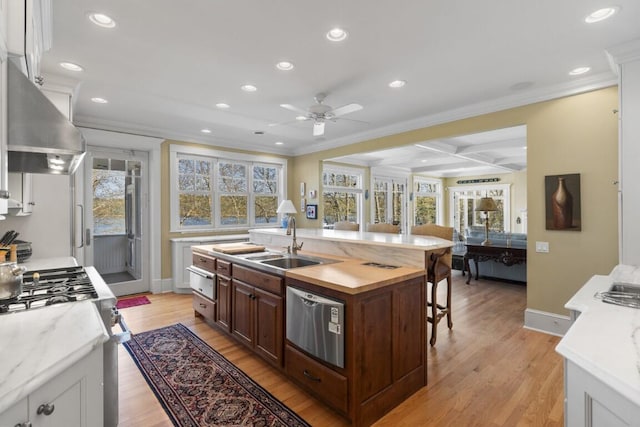 50 Higbee Ln, Boothbay, ME 04571 - kitchen with a sink, ornamental molding, recessed lighting, ceiling fan, and a kitchen island with sink