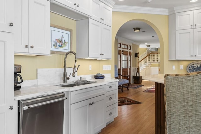 50 Higbee Ln, Boothbay, ME 04571 - kitchen featuring dishwasher, a sink, ornamental molding, wood finished floors, and arched walkways