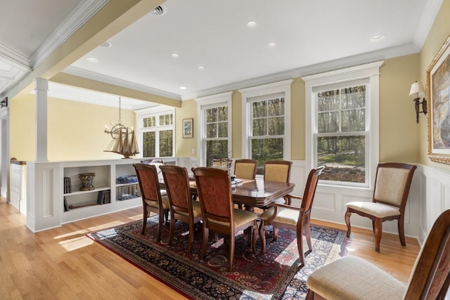 50 Higbee Ln, Boothbay, ME 04571 - dining room with light wood-type flooring, crown molding, a decorative wall, wainscoting, and recessed lighting