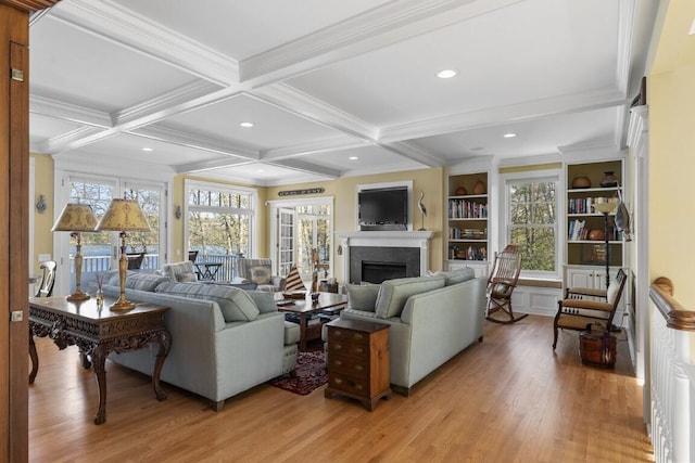 50 Higbee Ln, Boothbay, ME 04571 - living area featuring light wood-type flooring, a fireplace, beam ceiling, ornamental molding, and coffered ceiling