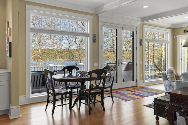 50 Higbee Ln, Boothbay, ME 04571 - dining room with light wood-type flooring, french doors, plenty of natural light, beamed ceiling, and crown molding