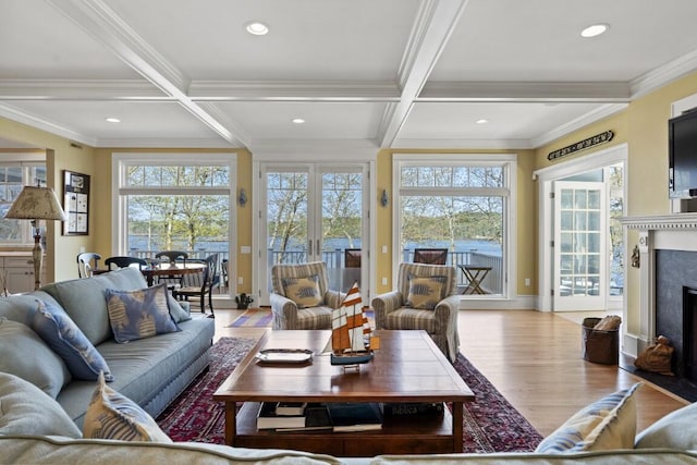 50 Higbee Ln, Boothbay, ME 04571 - living area featuring light wood finished floors, crown molding, coffered ceiling, a premium fireplace, and beamed ceiling