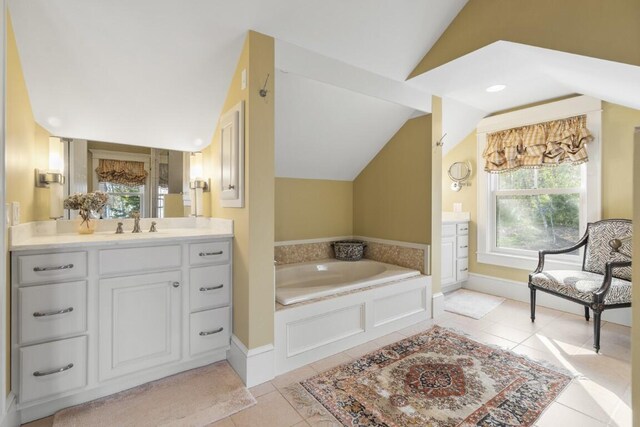 50 Higbee Ln, Boothbay, ME 04571 - full bathroom with lofted ceiling, vanity, a garden tub, plenty of natural light, and tile patterned flooring