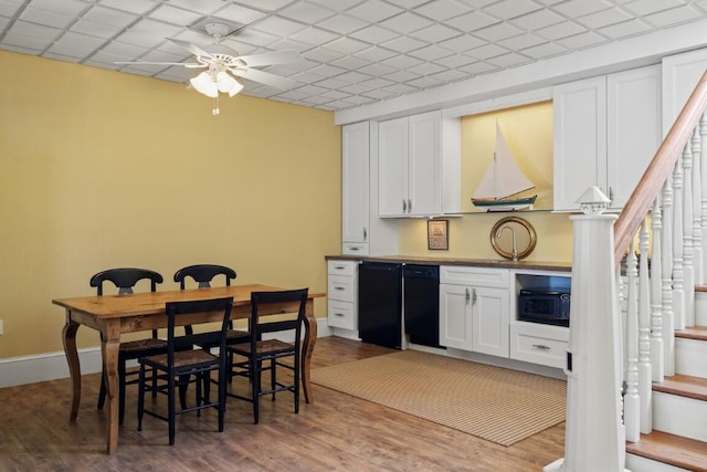 50 Higbee Ln, Boothbay, ME 04571 - dining space featuring ceiling fan, wood finished floors, stairs, and baseboards