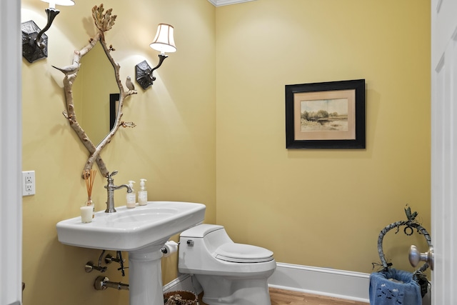 50 Higbee Ln, Boothbay, ME 04571 - half bathroom featuring toilet, wood finished floors, and baseboards