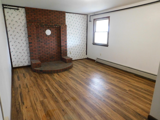 81 S Main St, Athens, ME 04912 - unfurnished room with baseboard heating, wood finished floors, and wallpapered walls