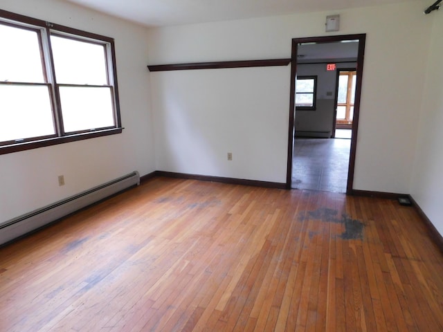 81 S Main St, Athens, ME 04912 - empty room featuring hardwood / wood-style floors, baseboards, and a baseboard heating unit
