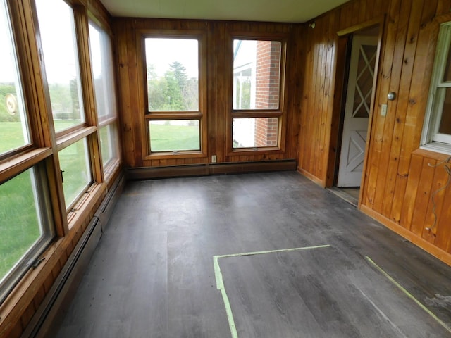 81 S Main St, Athens, ME 04912 - unfurnished sunroom with wood walls, a baseboard radiator, wood finished floors, and baseboards