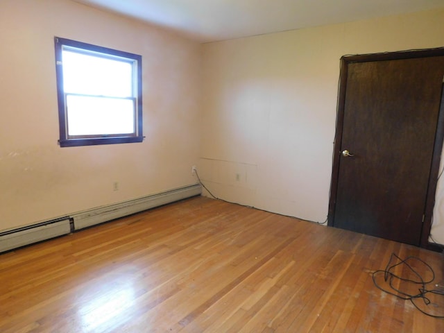 81 S Main St, Athens, ME 04912 - spare room featuring light wood finished floors and a baseboard heating unit