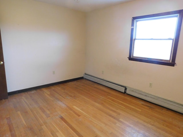 81 S Main St, Athens, ME 04912 - spare room with baseboard heating, light wood-type flooring, and baseboards