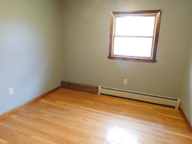 81 S Main St, Athens, ME 04912 - spare room featuring baseboard heating, wood finished floors, and baseboards