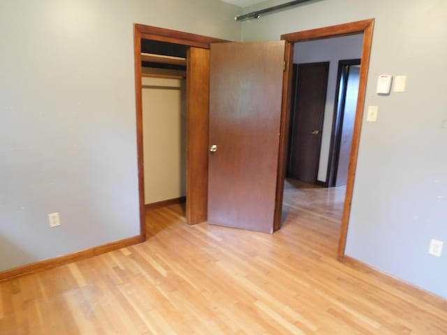 81 S Main St, Athens, ME 04912 - unfurnished bedroom featuring light wood finished floors, a closet, and baseboards