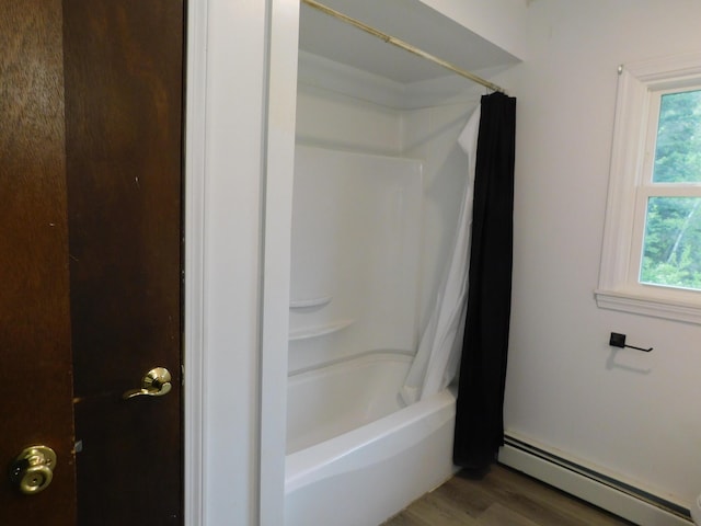 81 S Main St, Athens, ME 04912 - full bath featuring baseboard heating, wood finished floors, and shower / tub combo with curtain