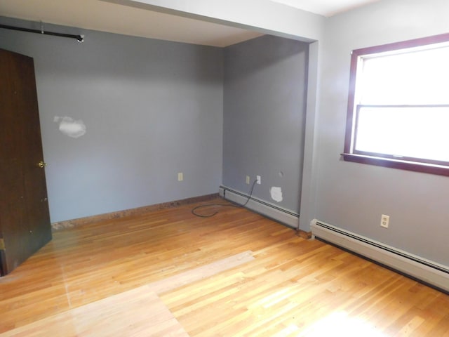 81 S Main St, Athens, ME 04912 - spare room with a baseboard radiator, wood finished floors, and baseboards