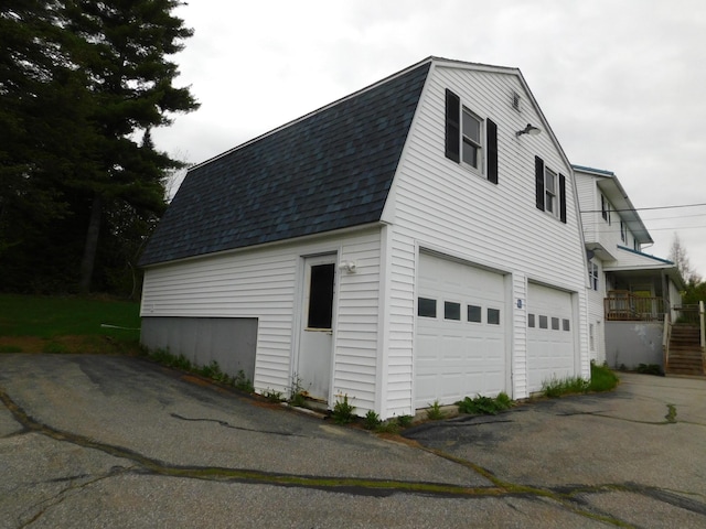 81 S Main St, Athens, ME 04912 - garage featuring asphalt driveway