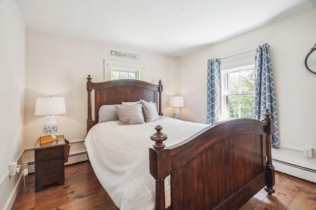 70 Cider Hill Rd, York, ME 03909 - bedroom featuring multiple windows, baseboard heating, and hardwood / wood-style flooring