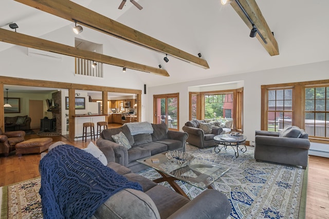 70 Cider Hill Rd, York, ME 03909 - living room with rail lighting, wood finished floors, beamed ceiling, high vaulted ceiling, and a ceiling fan