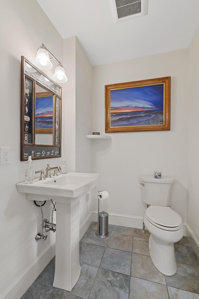 70 Cider Hill Rd, York, ME 03909 - bathroom featuring baseboards and toilet