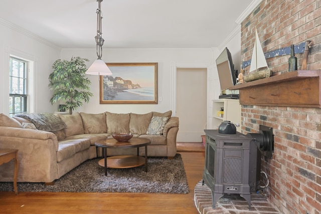 70 Cider Hill Rd, York, ME 03909 - living area featuring wood finished floors, ornamental molding, and a wood stove