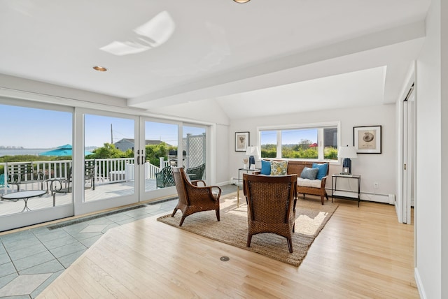 25 Ocean Ave, Cape Elizabeth, ME 04107 - living area featuring light wood-type flooring, a baseboard radiator, vaulted ceiling, and baseboards