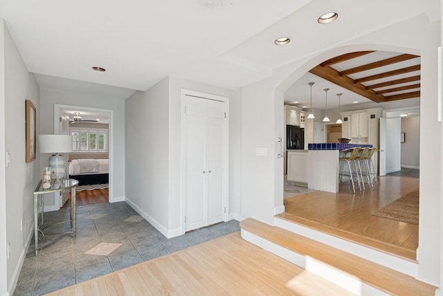 25 Ocean Ave, Cape Elizabeth, ME 04107 - foyer featuring baseboards, arched walkways, recessed lighting, beam ceiling, and light wood finished floors